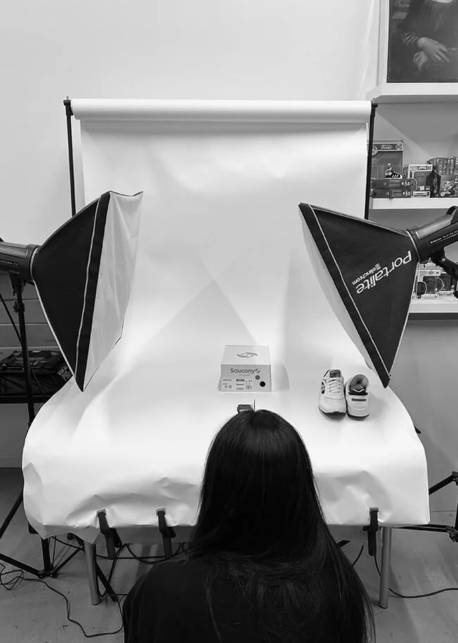Behind-the-scenes of a studio photo shoot with softbox lighting